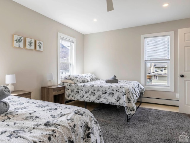 7614 Main St, Hunter, NY 12444 - bedroom with a baseboard heating unit, recessed lighting, ceiling fan, and light wood-type flooring