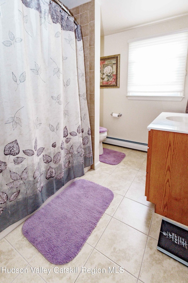 bathroom featuring tile patterned flooring, vanity, toilet, curtained shower, and a baseboard radiator