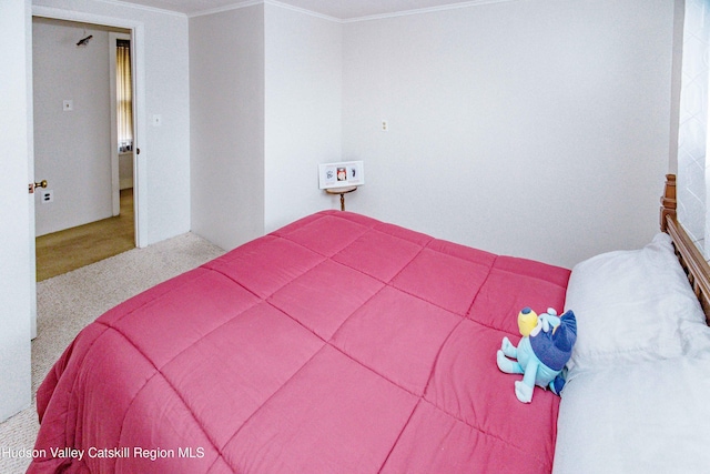 carpeted bedroom with crown molding