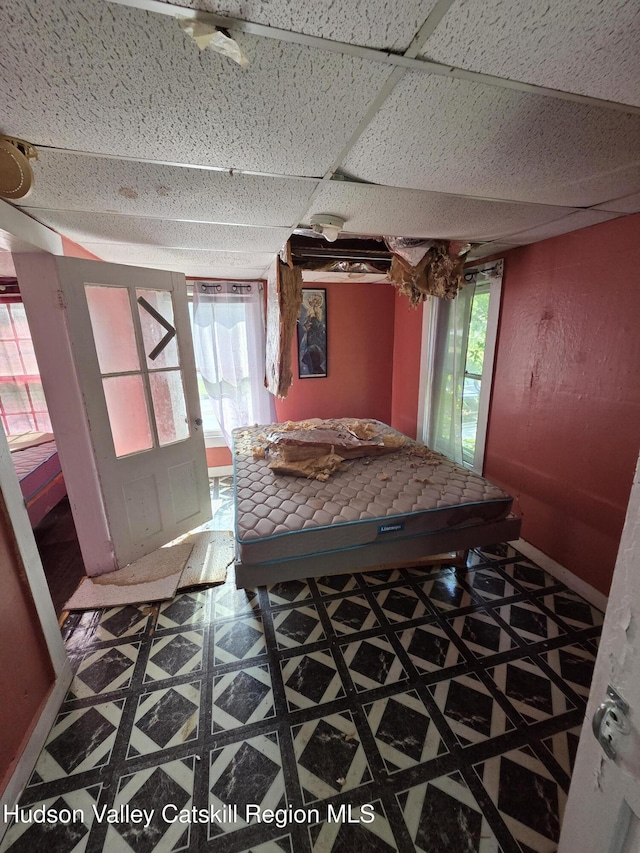 95 Spring St, Catskill, NY 12414 - bedroom with a drop ceiling and tile patterned floors