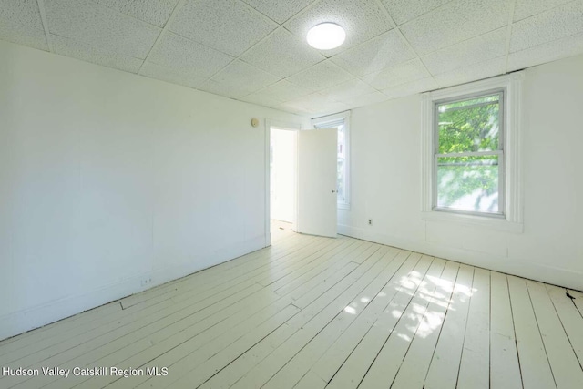 9 Hasbrouck Pl, Kingston, NY 12401 - empty room with a paneled ceiling and wood-type flooring
