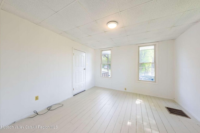 9 Hasbrouck Pl, Kingston, NY 12401 - unfurnished room with a paneled ceiling and wood finished floors