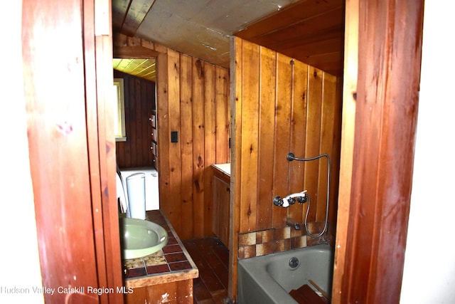 667 W Platner Brook Rd, Delhi, NY 13753 - full bath featuring wood walls, vanity, wooden ceiling, and tub / shower combination