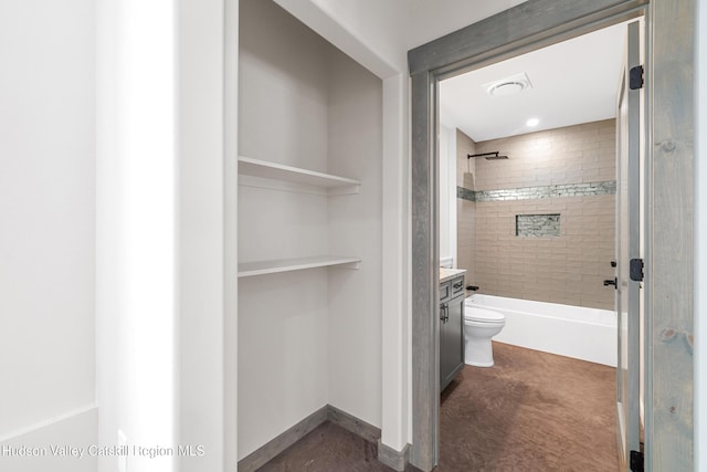 full bathroom featuring vanity, toilet, and tiled shower / bath