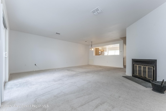 29 Penstock Ln, Lake Katrine, NY 12449 - unfurnished living room with carpet floors, a glass covered fireplace, and baseboards