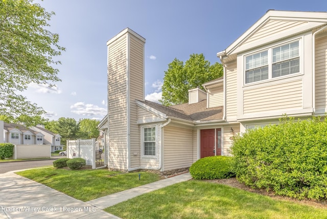 29 Penstock Ln, Lake Katrine, NY 12449 - view of property with a chimney, a front yard, and roof with shingles