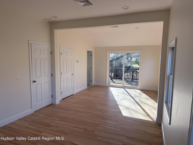16 Trinity Pl, Rhinebeck, NY 12572 - corridor with wood finished floors, baseboards, and vaulted ceiling