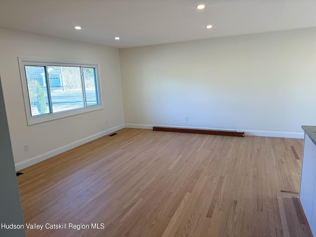 16 Trinity Pl, Rhinebeck, NY 12572 - empty room featuring light wood finished floors, baseboards, and recessed lighting