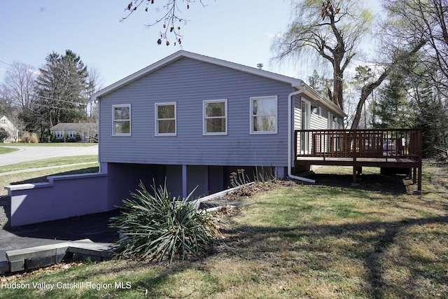16 Trinity Pl, Rhinebeck, NY 12572 - view of property exterior featuring a deck and a yard