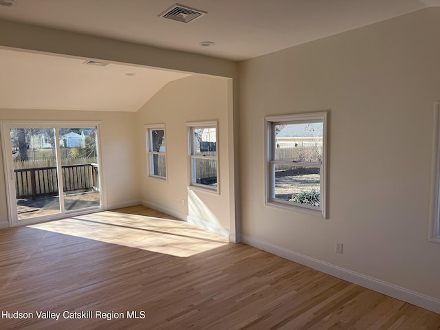 16 Trinity Pl, Rhinebeck, NY 12572 - empty room featuring vaulted ceiling, wood finished floors, and baseboards