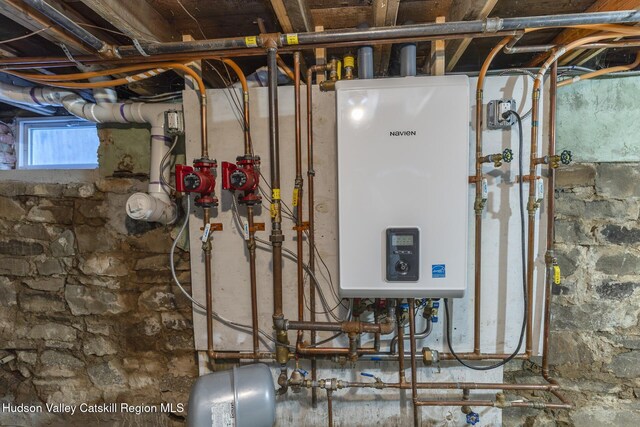 utility room with tankless water heater