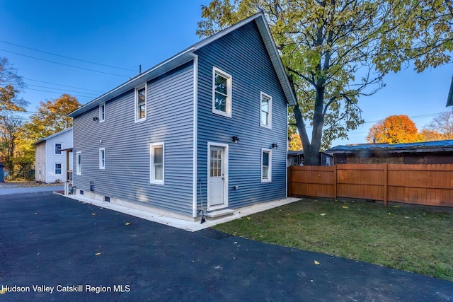 view of home's exterior with a yard