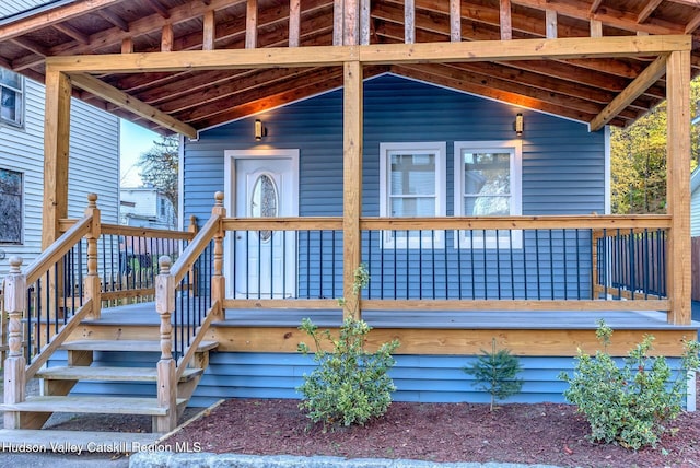 property entrance featuring covered porch