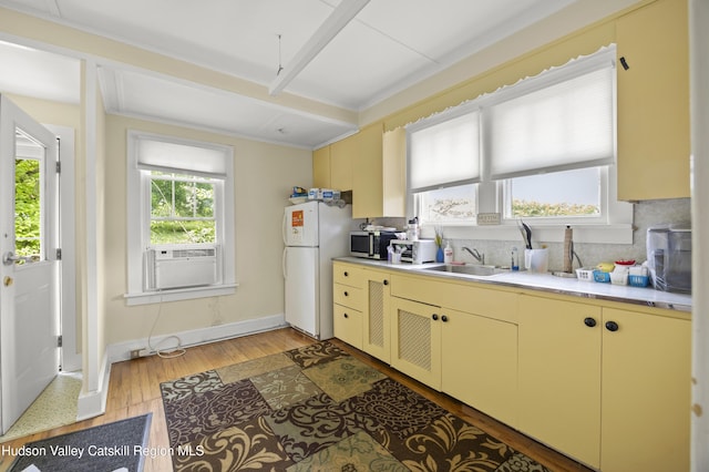 207 Maple Ave, Germantown, NY 12526 - kitchen with freestanding refrigerator, cooling unit, tasteful backsplash, cream cabinets, and beamed ceiling