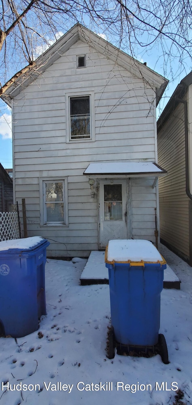 view of snow covered house