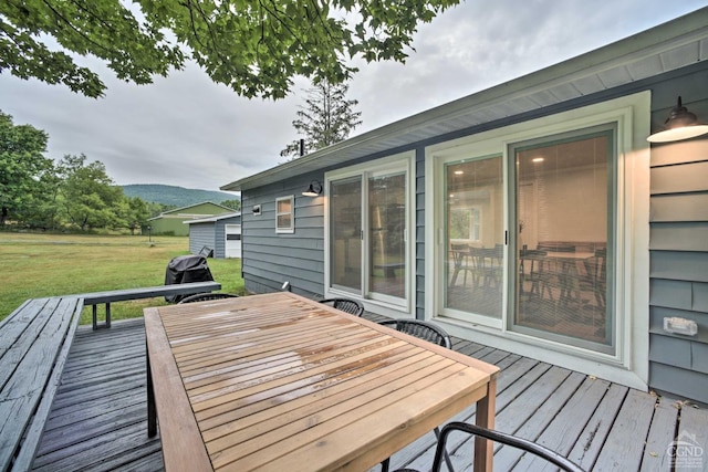 871 Mail Route Rd, Ashland, NY 12407 - wooden deck featuring outdoor dining space, a lawn, and a mountain view