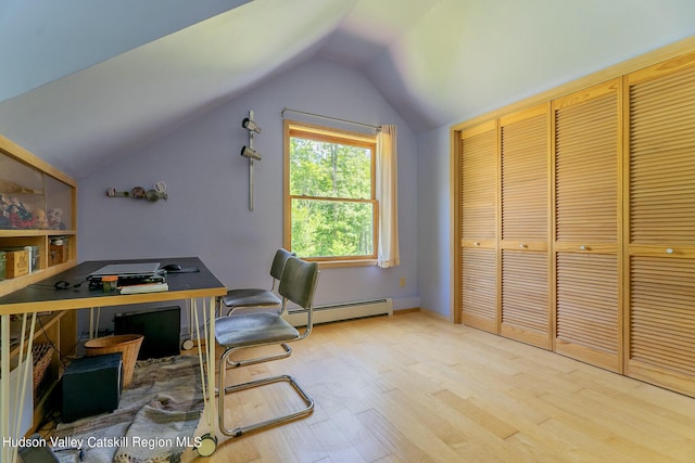 office with baseboard heating, hardwood / wood-style floors, and vaulted ceiling