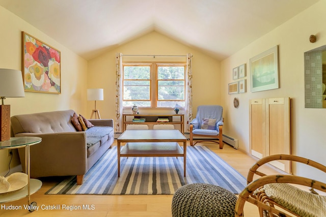 living area with light wood-type flooring, a baseboard radiator, and vaulted ceiling