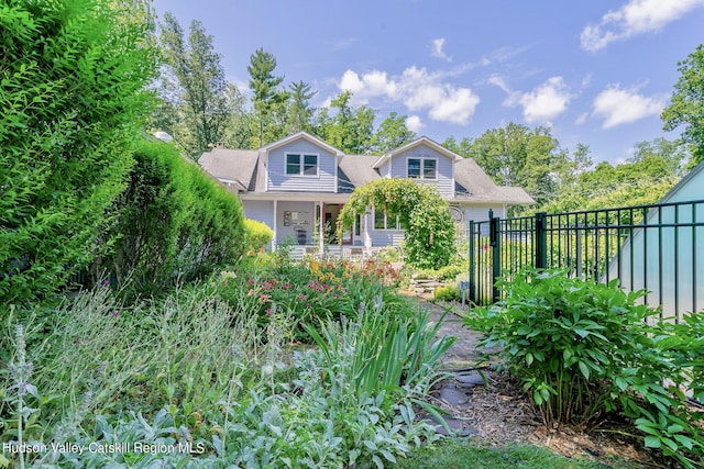 view of front of home with a water view