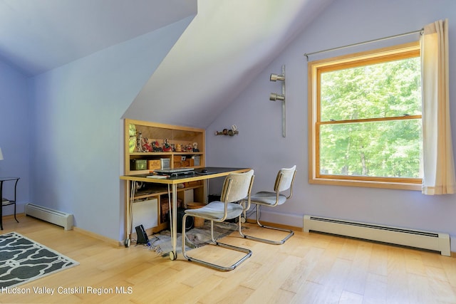 office with baseboard heating, vaulted ceiling, and light wood-type flooring