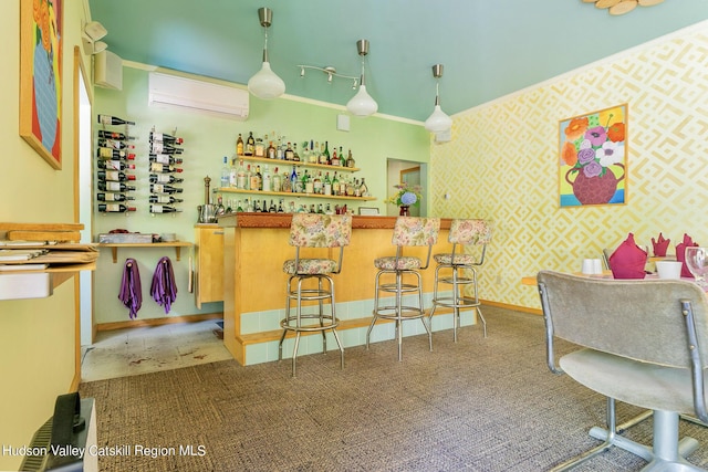 bar featuring an AC wall unit, hanging light fixtures, and ornamental molding