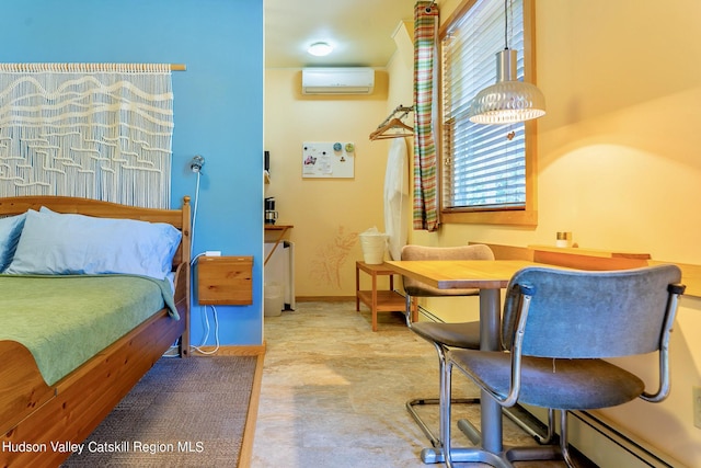 bedroom featuring a wall unit AC and a baseboard heating unit