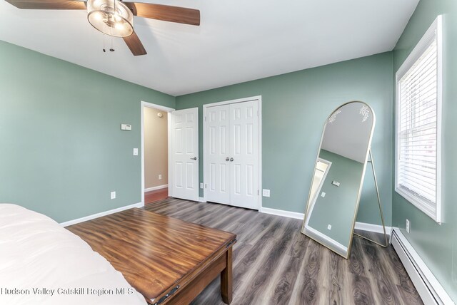 doorway to outside featuring a paneled ceiling, a wood stove, and a wealth of natural light