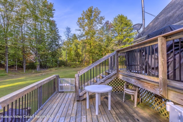 deck featuring a lawn