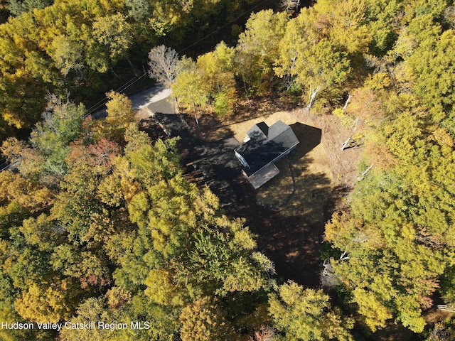 drone / aerial view featuring a forest view