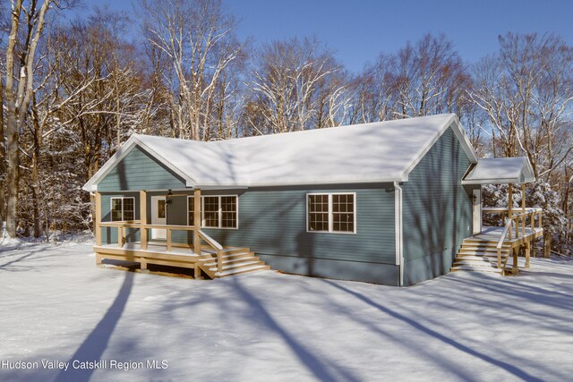 rustic home featuring covered porch