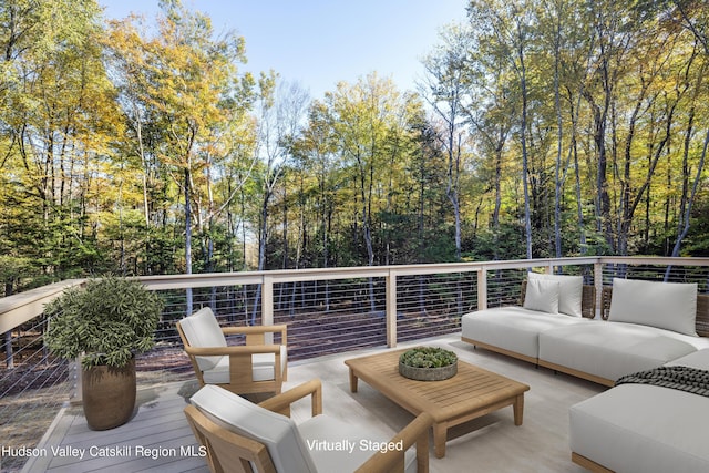 wooden deck with an outdoor hangout area