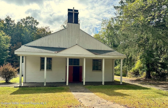 71 Watson Hollow Rd, West Shokan, NY 12494 - view of front of house with a front lawn, a porch, a shingled roof, and a chimney