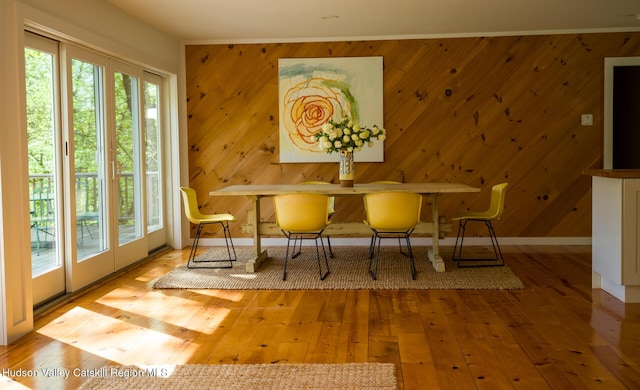 35 Jilroy Ln, Spencertown, NY 12165 - dining room with wood-type flooring, baseboards, and wood walls