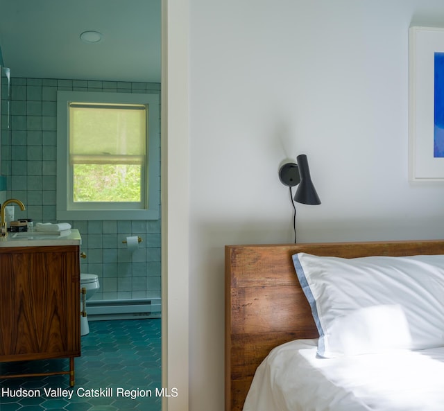 35 Jilroy Ln, Spencertown, NY 12165 - bedroom with tile walls, baseboard heating, and ensuite bathroom
