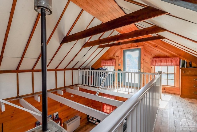 unfinished attic featuring an upstairs landing