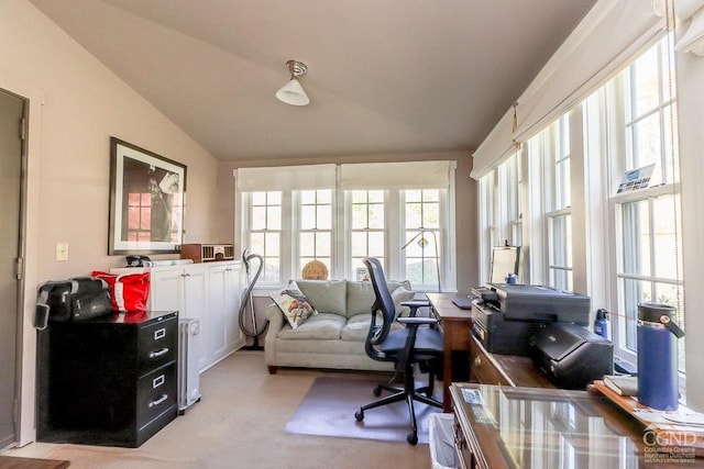 home office featuring lofted ceiling and light carpet