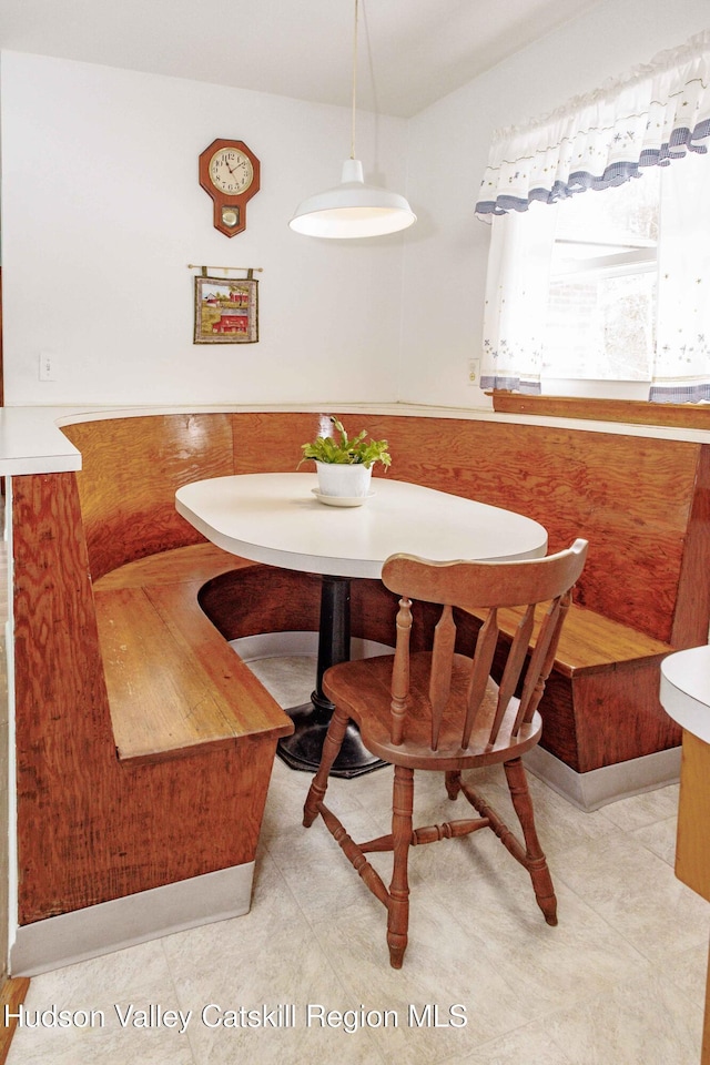 dining room with breakfast area and wainscoting