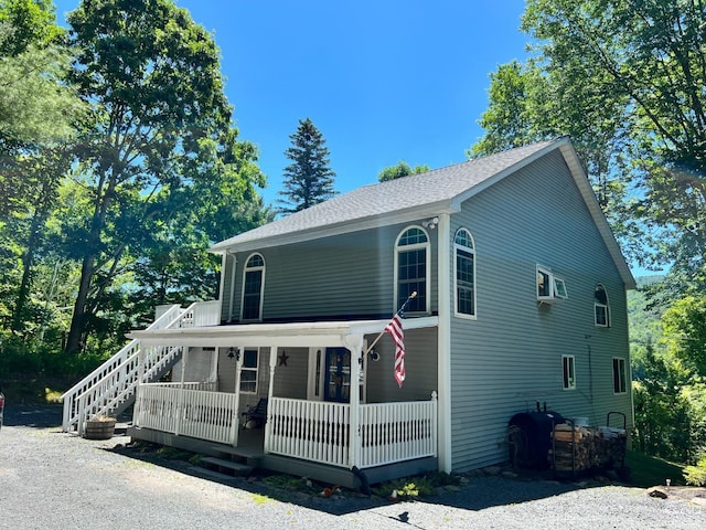 16 Hickory Hill Rd, Windham, NY 12496 - view of front of house featuring covered porch, roof with shingles, and stairs