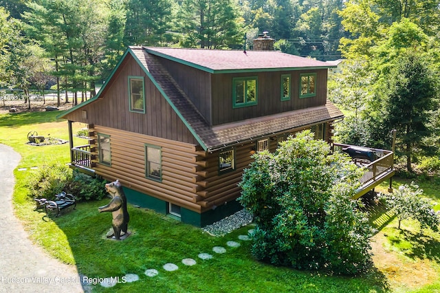 view of home's exterior with a lawn