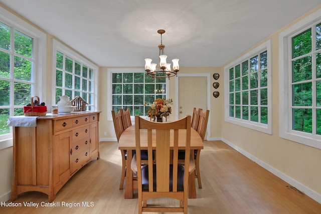 1055 Rte 212, Saugerties, NY 12477 - dining room with a chandelier, light wood-style floors, and plenty of natural light