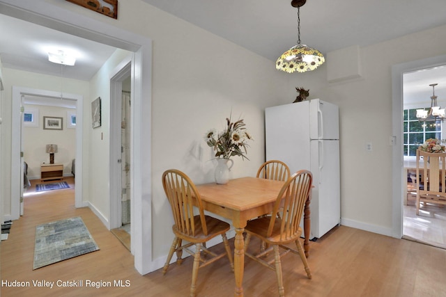 1055 Rte 212, Saugerties, NY 12477 - dining room with light wood-type flooring and a chandelier