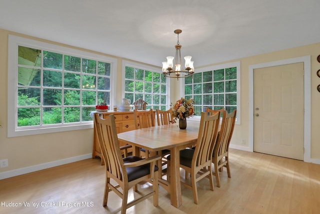 1055 Rte 212, Saugerties, NY 12477 - dining room featuring a chandelier and light wood-style flooring