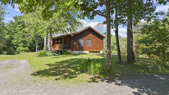 17 Partridge Rd, Hudson, NY 12534 - view of front of house featuring a front yard and log exterior