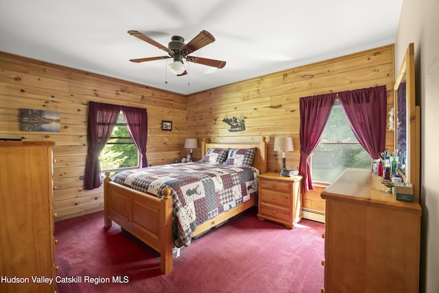 17 Partridge Rd, Hudson, NY 12534 - bedroom with carpet flooring, a baseboard radiator, wood walls, and ceiling fan