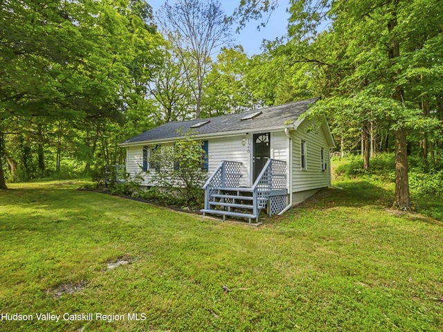 exterior space with a yard