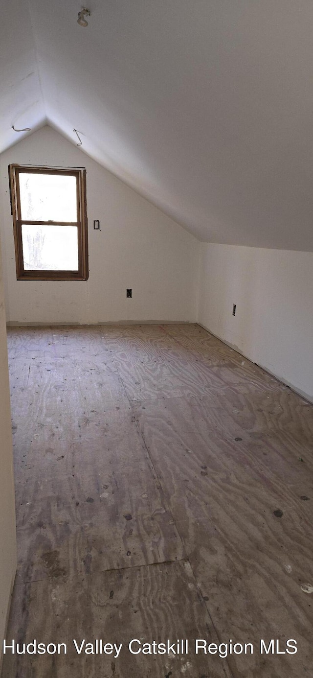 bonus room featuring vaulted ceiling