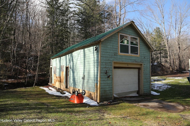 garage with a lawn