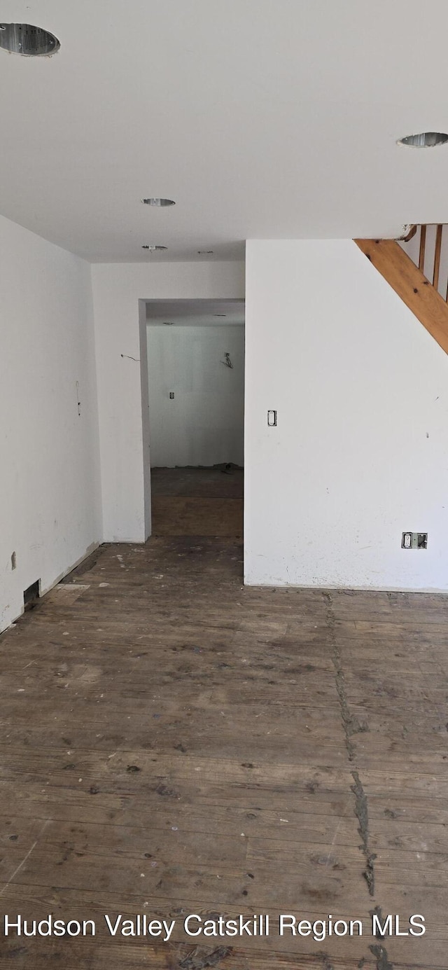 unfurnished room featuring dark hardwood / wood-style floors