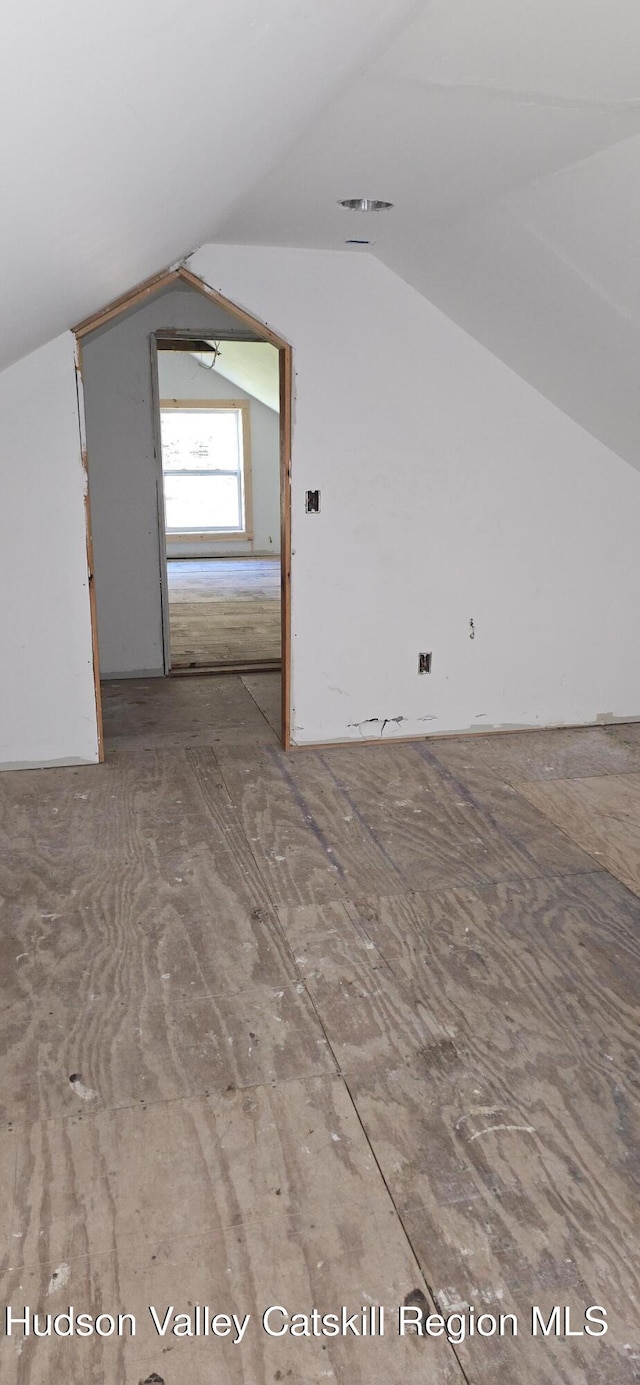 bonus room featuring vaulted ceiling