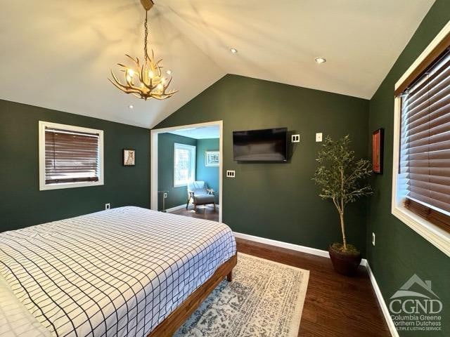 57 Bushnell Ave, Catskill, NY 12414 - bedroom with a chandelier, lofted ceiling, wood finished floors, and baseboards